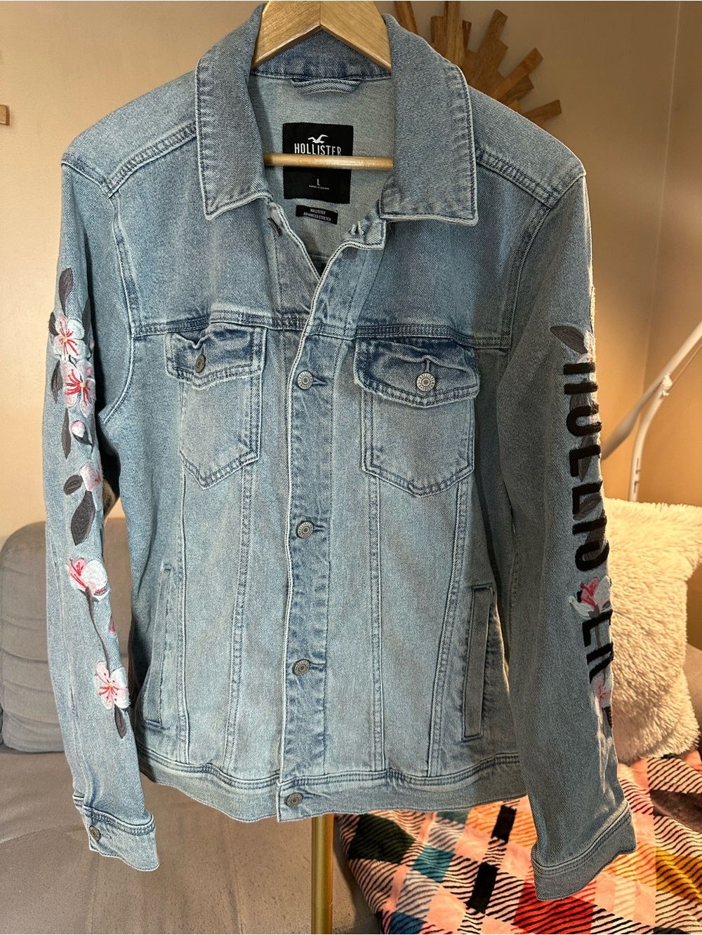 Hollister Light Blue Denim Jean Jacket with Floral Sleeve Embroidery and Logo